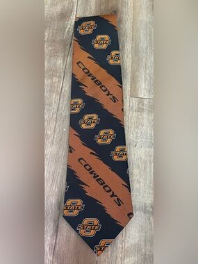 Oklahoma State Cowboys Logo Tie in Orange and Black. 100% Silk.